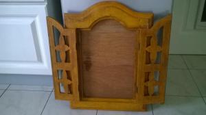 Porte miroir en bois sculpté à deux vantaux