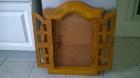 Porte miroir en bois sculpté à deux vantaux
